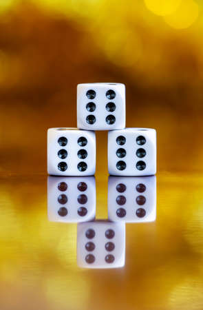 Winner dices on golden background. Life coaching, motivation, winning concept. Business success.の写真素材