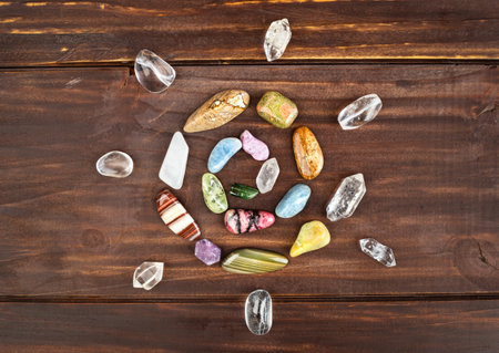 Colorful healing crystal stones, gemstones in happy spiral shape. Alternative therapy, chakra energy, reiki or spiritual background. Positivity.の写真素材