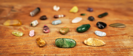 Colorful mineral stones, gemstones on wooden background. Alternative therapy, crystal healing...