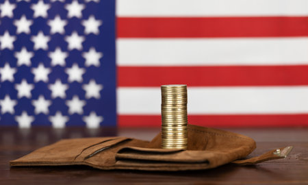 Gold money coins on a wallet with american flag, financial planning backgroundの写真素材