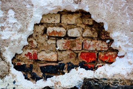 old wall with holeの写真素材