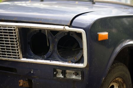 old broken car headlightの写真素材