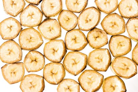 Sliced banana isolated on white background.   の写真素材