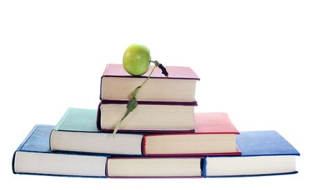apple on stack of books isolated on white backgroundの写真素材