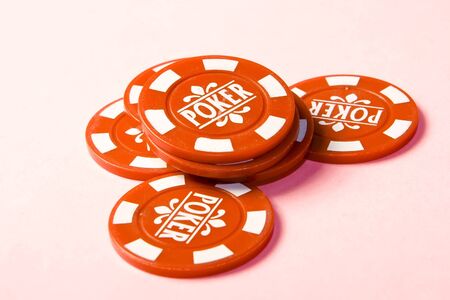 Gambling chips on a bright pink background.の写真素材