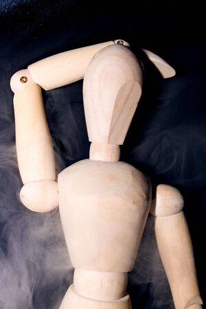 wooden mannequin in smokeの写真素材