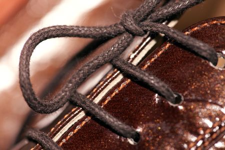 close-up shoes with laces on the brown bootsの写真素材