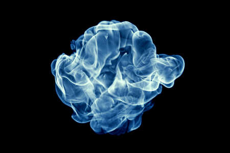 Blue fire isolated on a black background.の写真素材