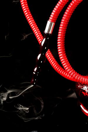 Red hookah on a black background