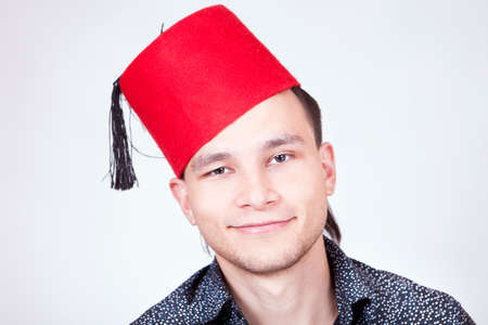 young man in red hat portraitの写真素材