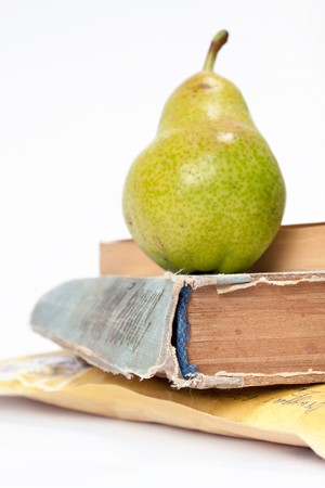 pear and old bookの写真素材