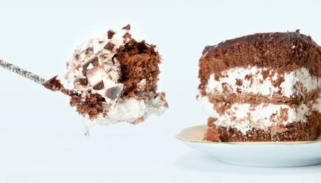 Spoon with piece of chocolate cake. の写真素材