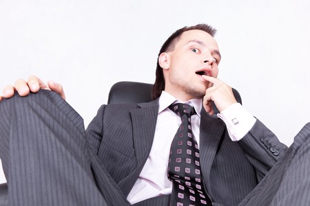 Young businessman sitting on chairの写真素材