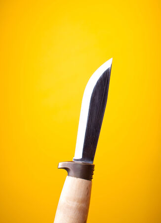 knife on yellow backgroundの写真素材