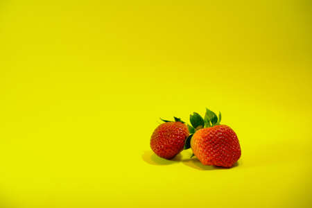 Set of strawberries on a yellow background.の写真素材