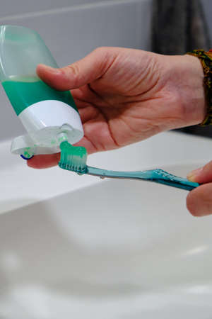 Toothbrush with green toothpaste tube