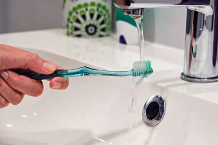 Toothbrush with green toothpaste tube