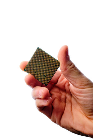 Man's hand holding a microChip with a white background.