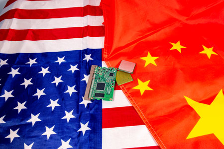Competition between two countries for technological domination, microchips in the middle of the usa and china flag.の写真素材