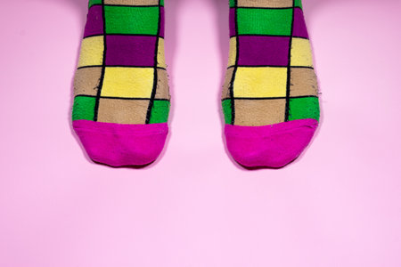Funky Feet: Multicolored Socks on Pink