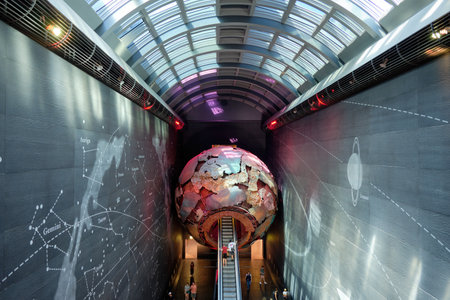 Red globe, leading to the earth's living room via an escalator, October 10, 2023 in London, UKのeditorial素材