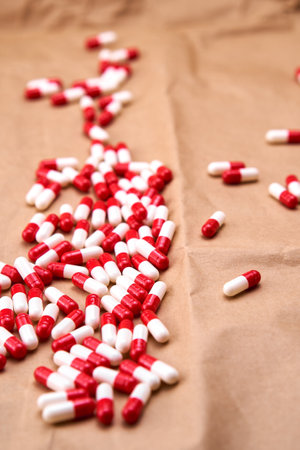 Red and white pharmacy capsules.の写真素材