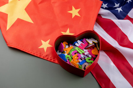 Gift box with wooden letters in the shape of a heart on the background of the flag of the USAの写真素材