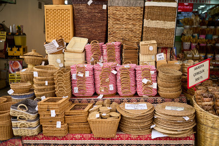 Handmade wicker baskets of different sizes and shapes for sale at a market.の写真素材