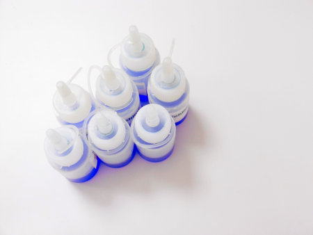 Closeup Of Bottles, Various Labeled And Capped Plastic Bottles Displayed In Neat Grid