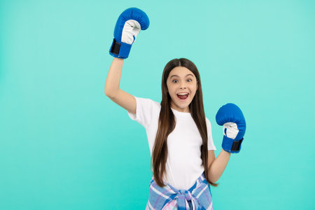 champion. power and authority. teen girl in sportswear boxing gloves. sport challenge.の写真素材