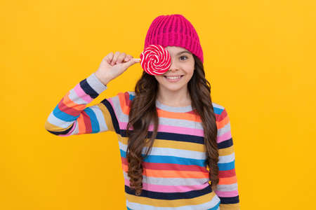 cheerful teen girl with lollipop candy, lollypopの写真素材