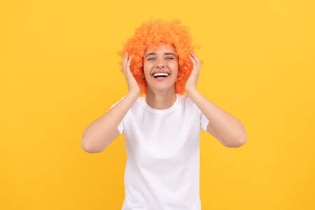 i am so happy. express positive emotions. cheerful lady wear wig. woman has orange hair.の写真素材