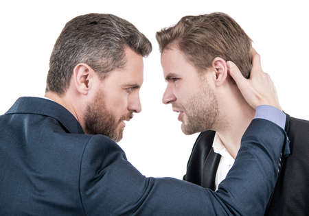 two businessmen starring to each other in business conflict, bad workの写真素材