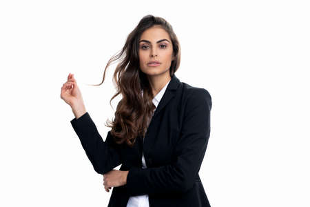 Professional woman with long wavy hair in formalwear isolated on white, hairstyleの写真素材