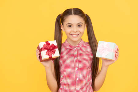 happy childhood. shopping final sell out. teenage shopper. cheerful teen girl with gift boxes.の写真素材