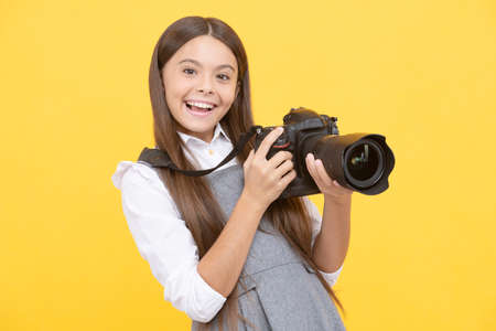 happy teen girl photographer use digital photo camera, photographing