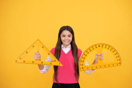 happy kid girl use protractor and triangle to learn mathematics, measurementの写真素材