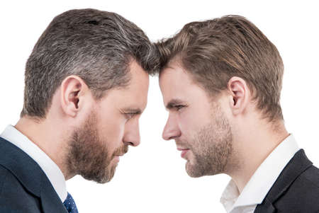 two businessmen starring to each other in business conflict, misunderstandingの写真素材
