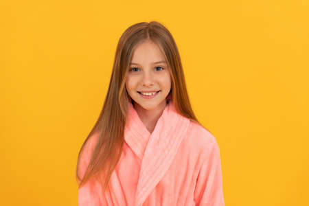 teen girl feeling relaxed. childhood happiness. good morning. kid wear soft night suit.の写真素材