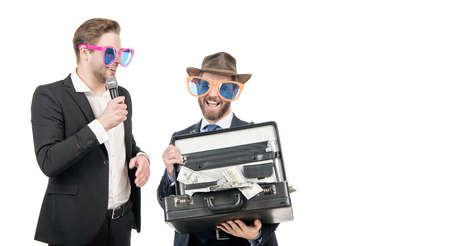 Welcome sponsor. Showman interview sponsor with money suitcase. Financial donor. Sponsoring companyの写真素材