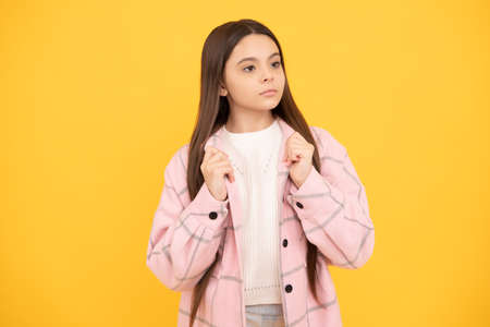 being so comfident. tween child wear plaid shirt. chequered flannel jacket. beauty and fashion.の写真素材