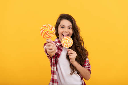 caramel candy shop. sweet childhood life. teen dental care. sweet tooth. yummy. girl hold lollipop