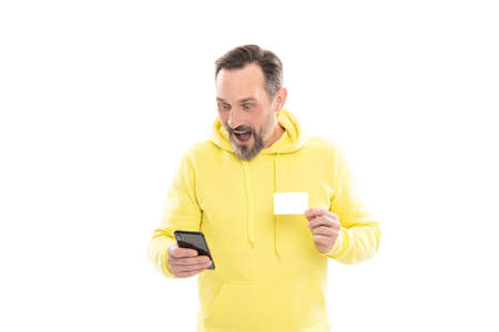 surprised man chatting on phone online card isolated on white copy space, shopping online.の写真素材