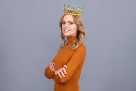 self confident queen. expressing smug. arrogant princess in tiara. proud woman smiling.の写真素材