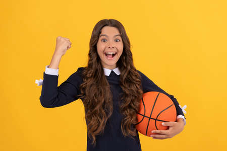 winning the game. sport and hobby. summer activity. teen girl with basketball ball.の写真素材