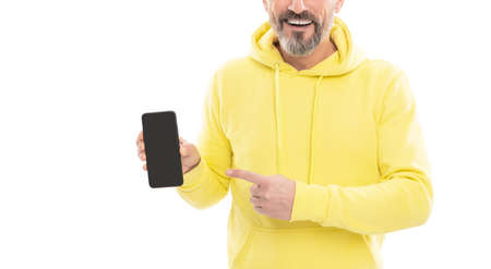 cropped man presenting smartphone screen pointing finger on copy space isolated on white, advert.の写真素材