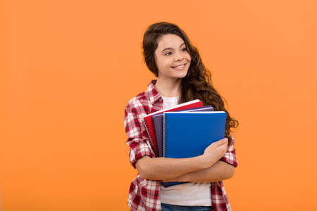happy school child ready to study with copybooks, knowledgeの写真素材