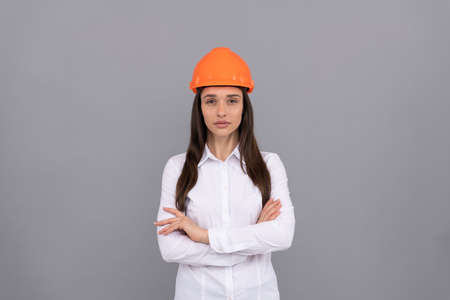 confident quality inspector. female construction worker. businesswoman in builder hardhatの写真素材