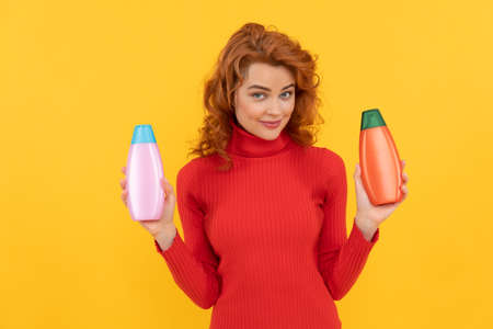 hair conditioner advertisement. beauty product. daily habits and personal care. redhead ladyの写真素材