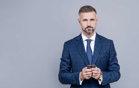 modern communication technology. man blogger use phone. professional ceo working online.の写真素材
